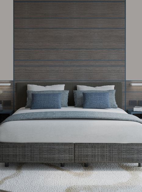 Modern bedroom with cozy bed, relaxing atmosphere, and soft colors.