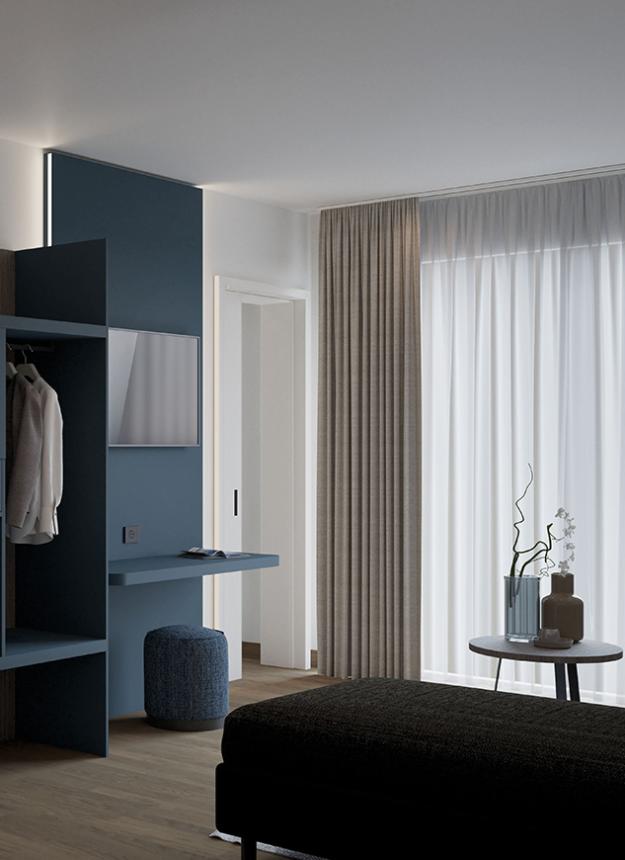 Modern, elegant, minimalist room with blue furnishings and soft lighting.